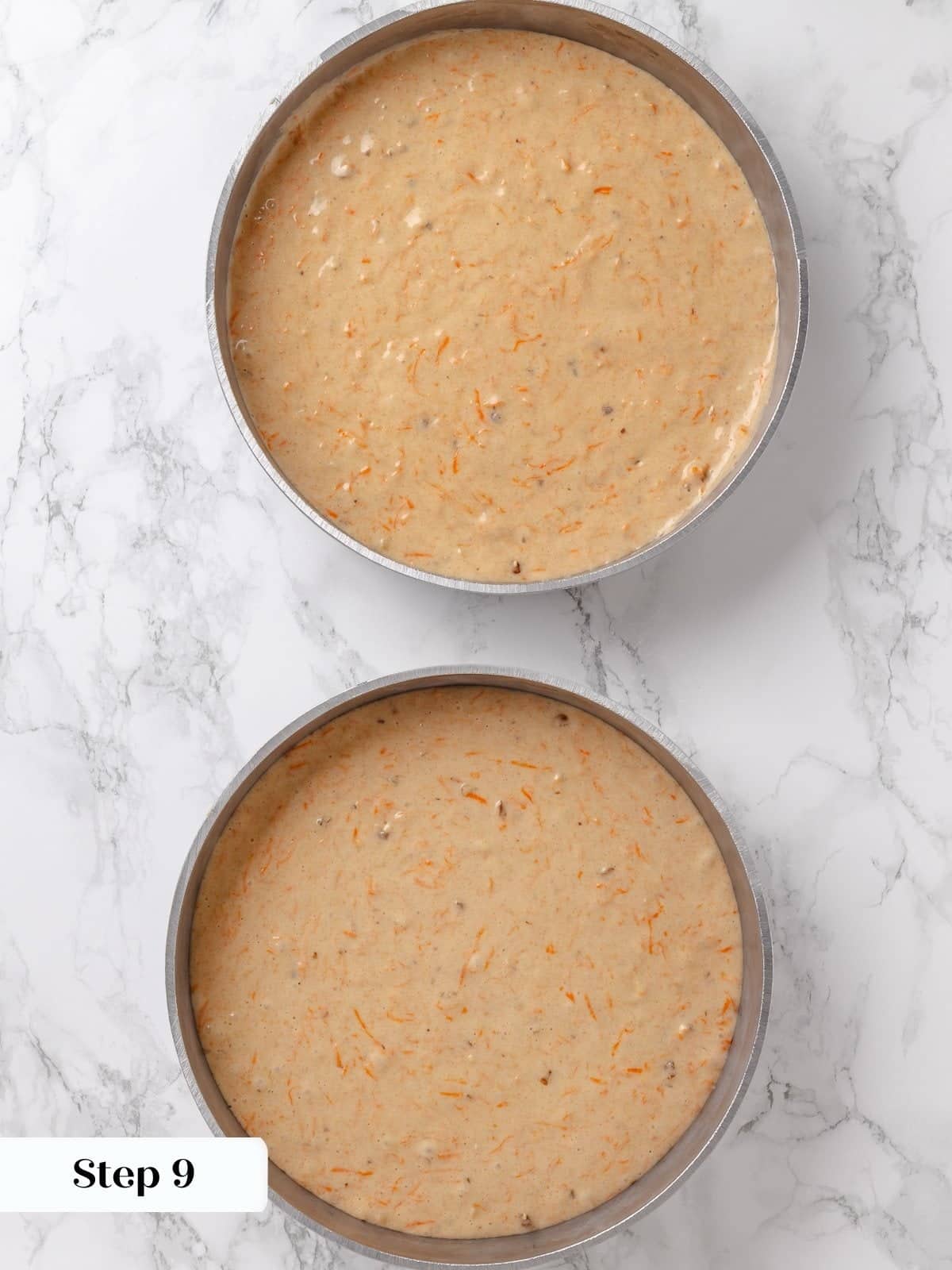 Dividing cake batter evenly into round pans.