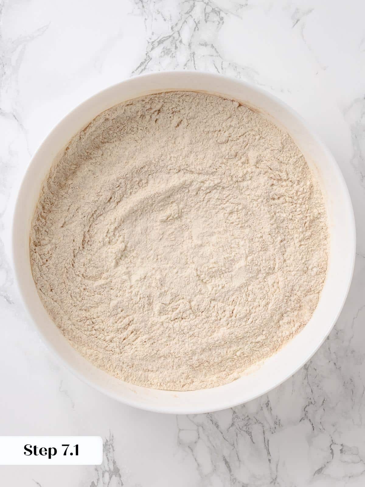 Bowl of flour, baking soda, and spices mixed together.