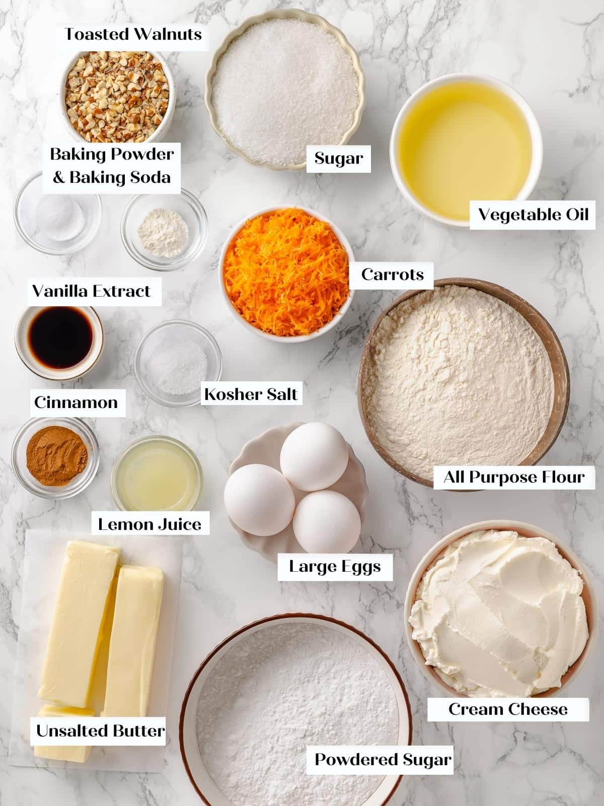 Prepped ingredients for carrot cake laid out on counter.