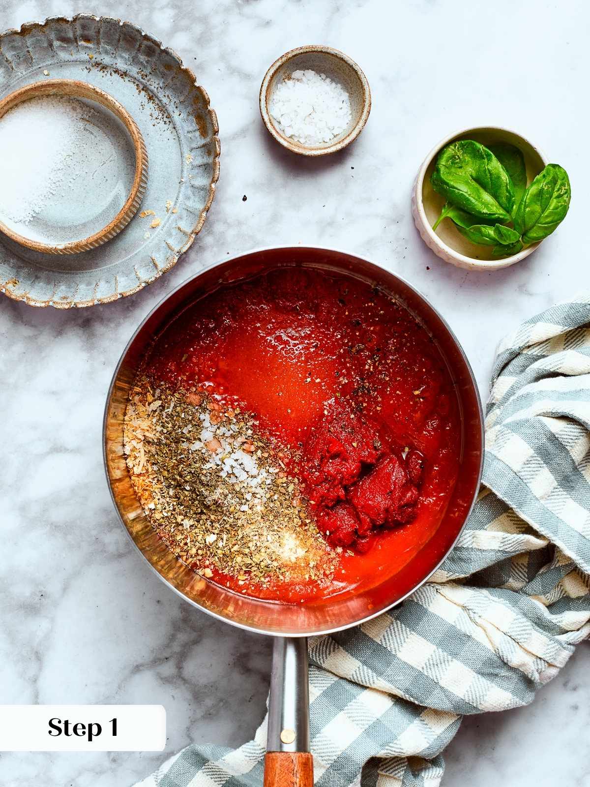 Ingredients blending into a bright red pizza sauce.