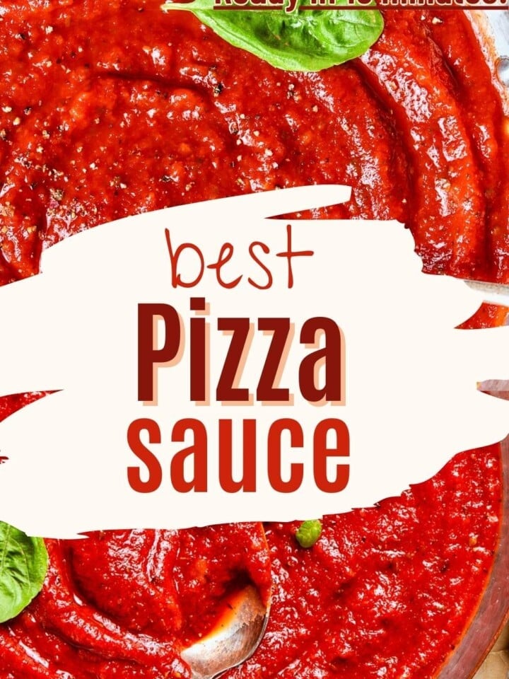 Homemade pizza sauce in a silver pan on a stovetop.