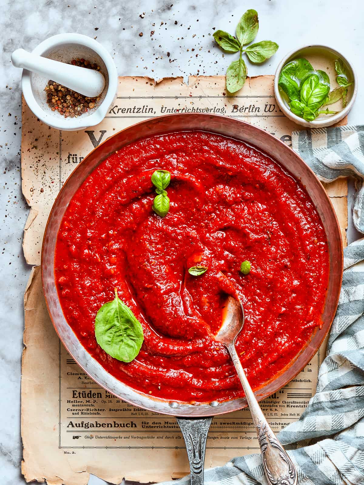 Close-up of velvety pizza sauce with smooth texture and rich color.