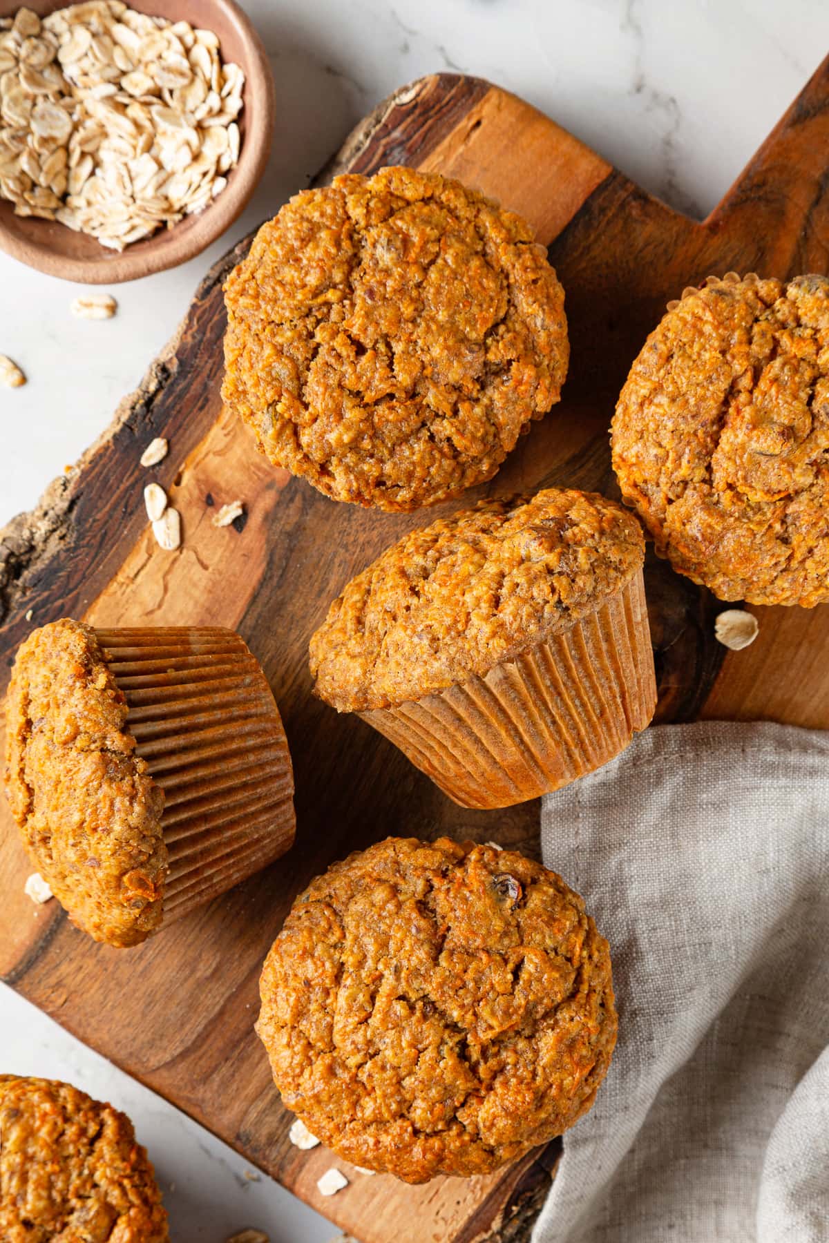 Warm carrot muffins fresh from the oven with golden tops.
