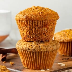 Thick, golden muffin with rustic texture and oat topping.