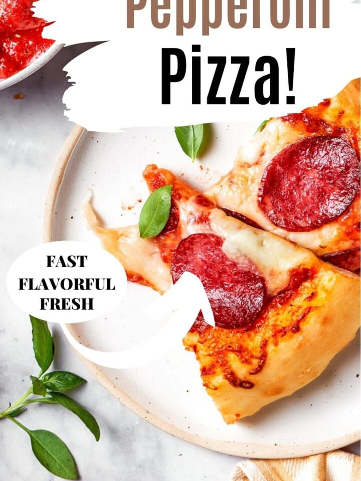 Sliced pepperoni pizza ready to serve on a white plate.