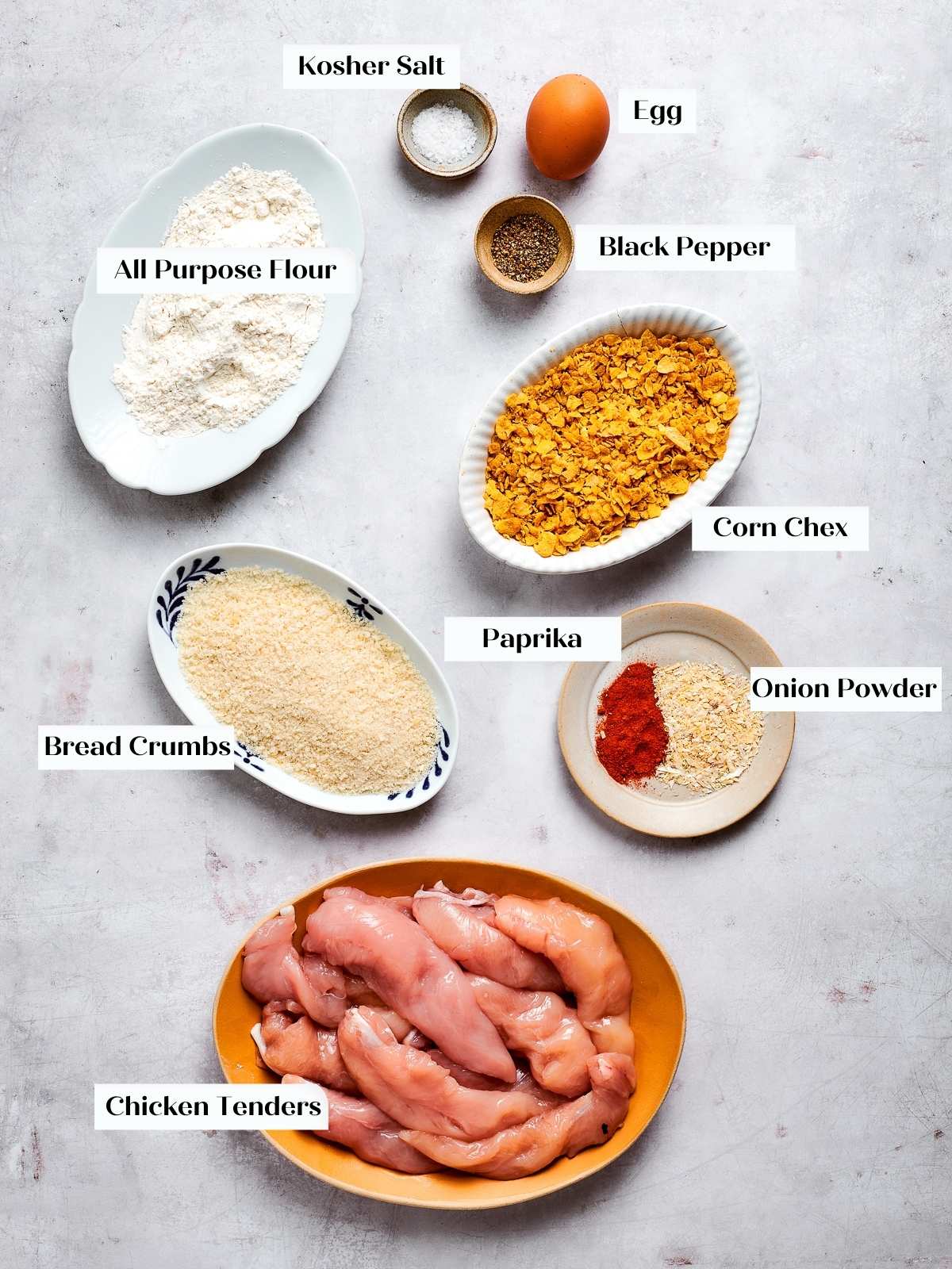 All ingredients for air fryer chicken tenders laid out on countertop for prep.