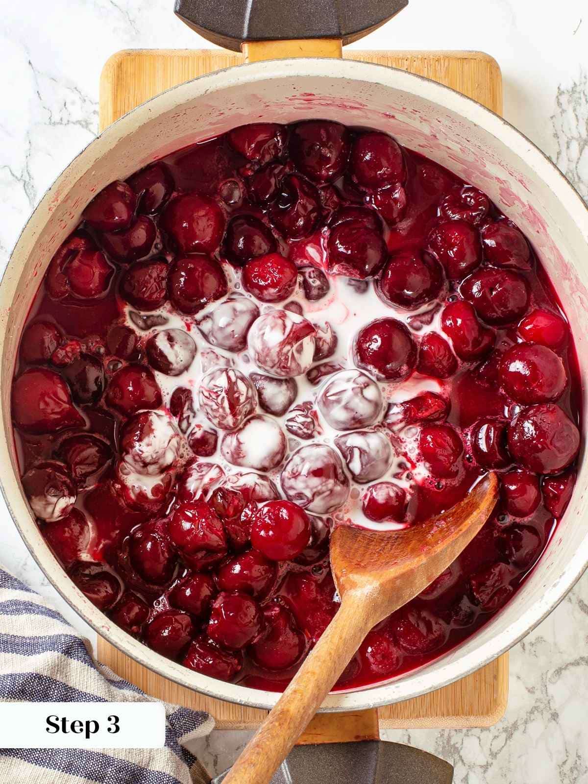 Thickener added to saucepan of cherries to begin thickening the filling as it cooks.