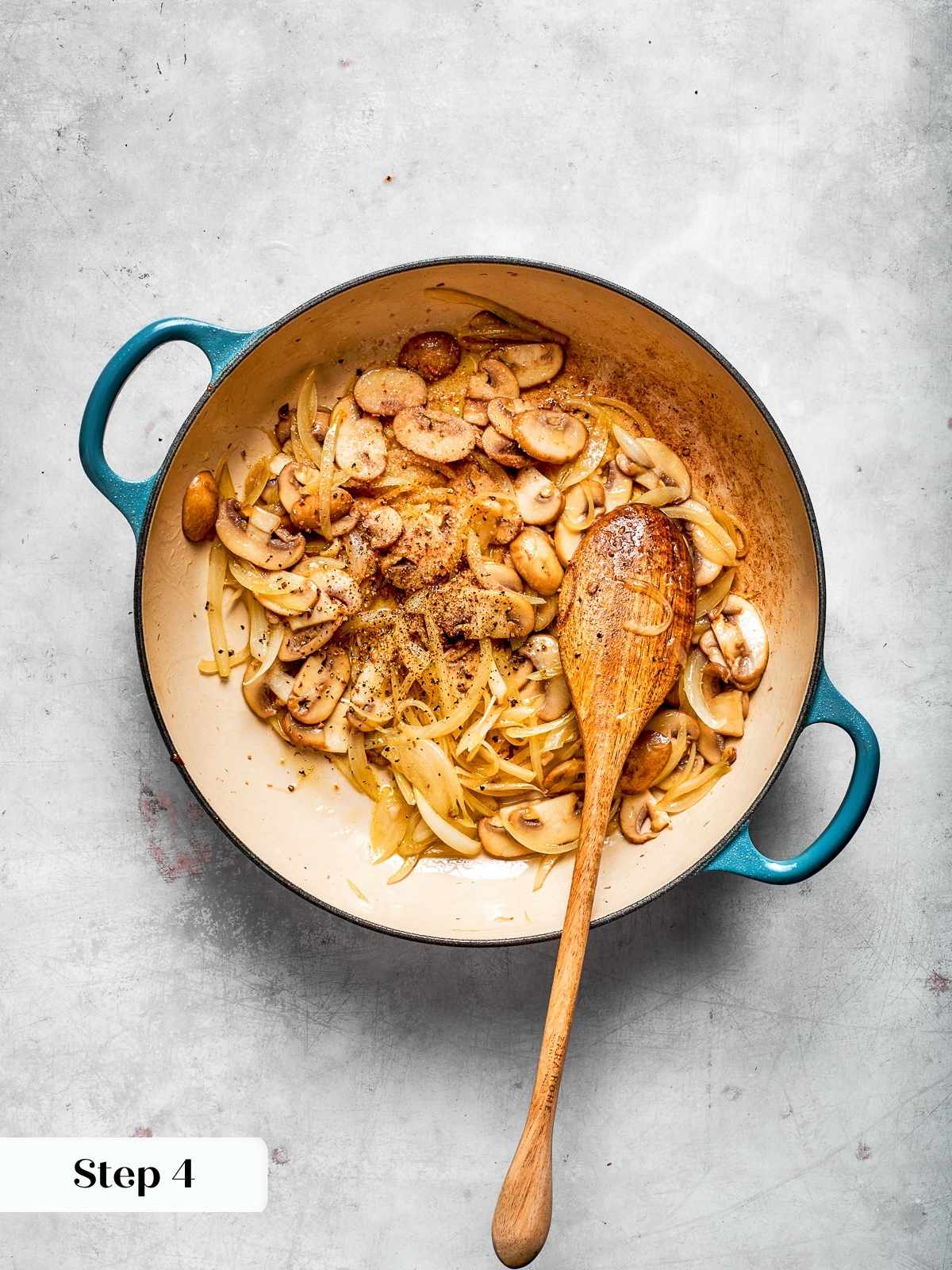 Sautéed onions and mushrooms caramelized in skillet before adding chicken and sauce.