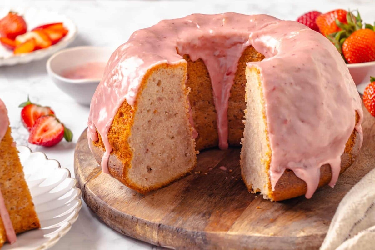Moist strawberry pound cake sliced open to reveal its soft, buttery interior and tender crumb.
