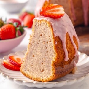 Fresh glaze dripping slowly along the cake’s edges, adding texture and color.