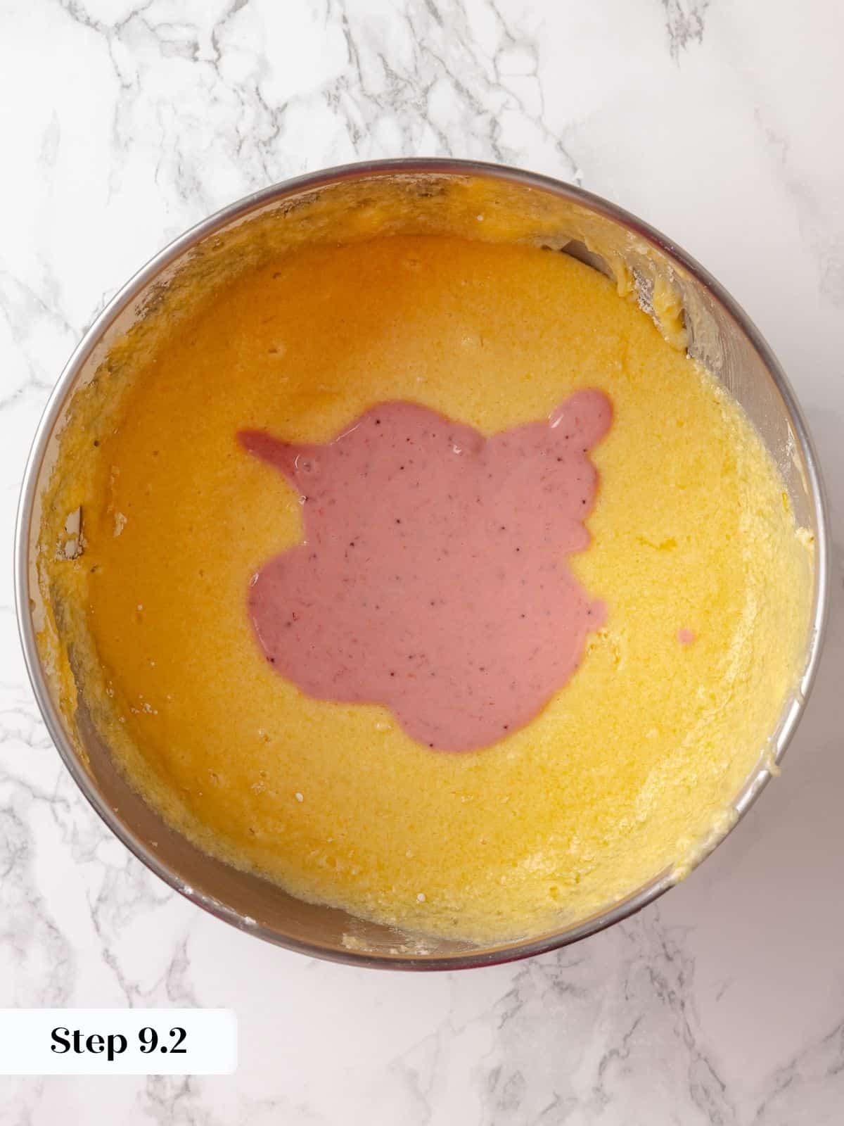 Strawberry-swirled sour cream added to the cake batter during mixing.