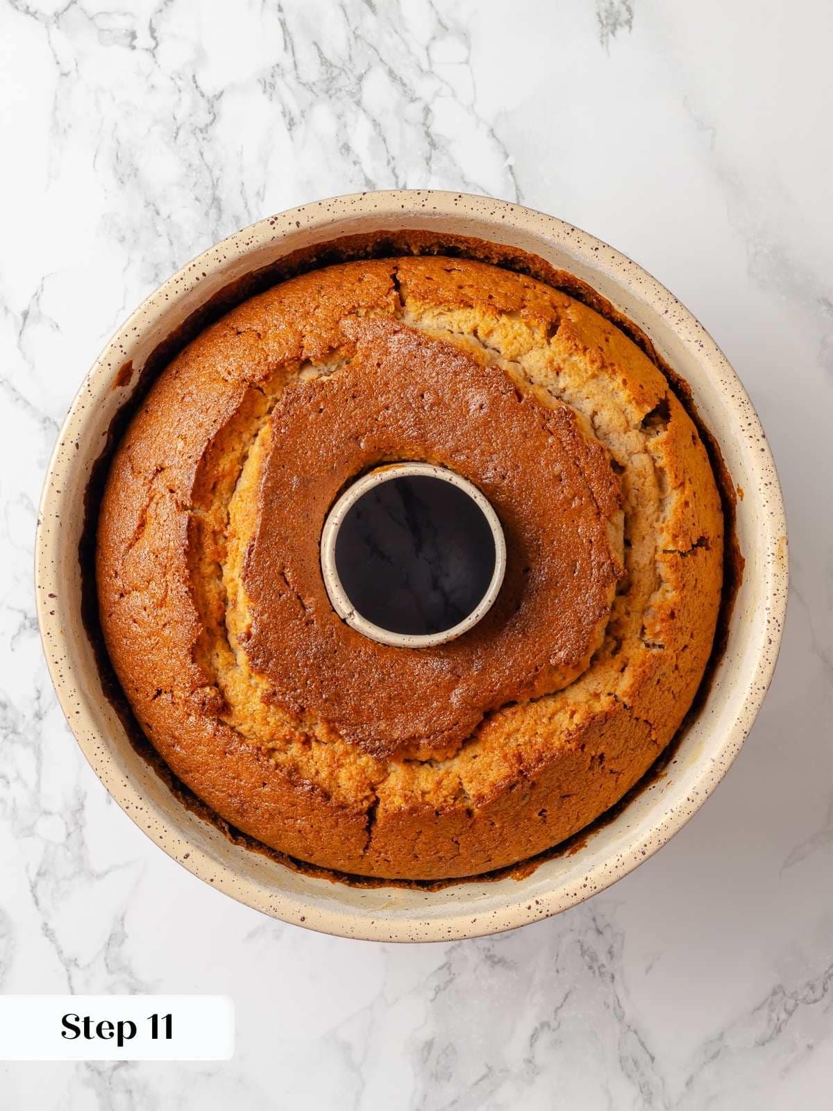 Golden brown cake fresh from the oven, still in the bundt pan.