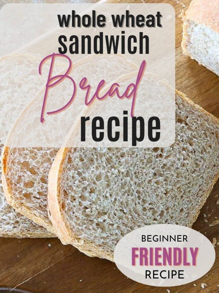 A golden loaf of whole wheat sandwich bread sliced to show the pillowy inside texture.