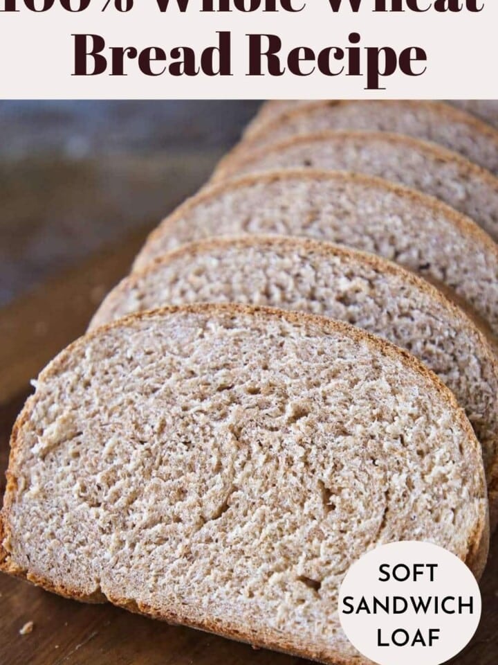 Sliced whole wheat bread loaf showing chewy texture and golden crust fresh from the oven.