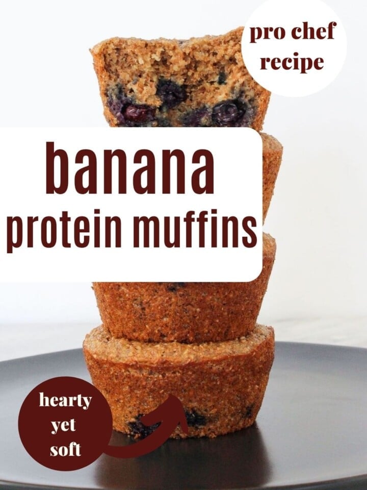 Banana muffins filled with bran, blueberries, and protein powder, stacked on a black plate for serving.