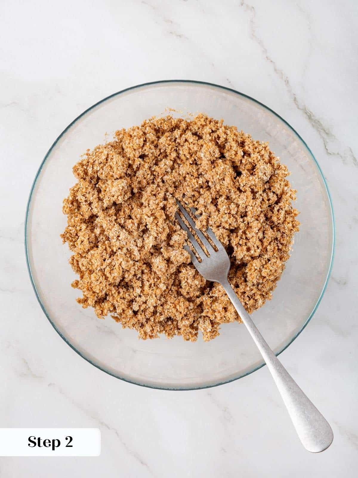 Buttermilk and wheat bran stirred together in a small bowl to soften before baking muffins.