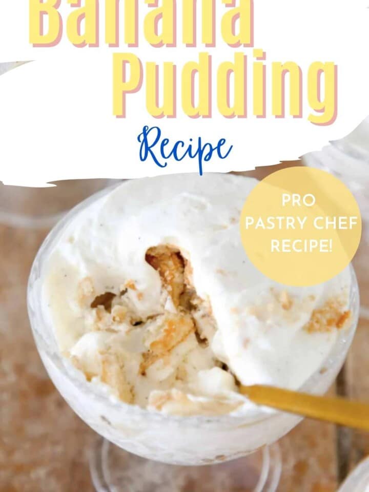 Cup of banana pudding with a spoonful showing the layers of banana and Nilla wafers.