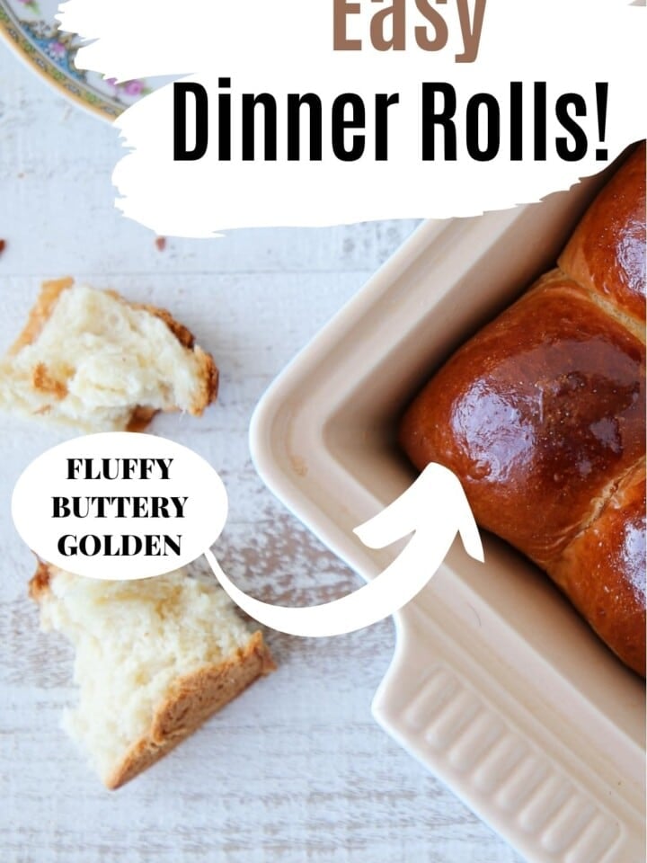 Freshly baked dinner rolls arranged in a pan, golden on top and soft inside.