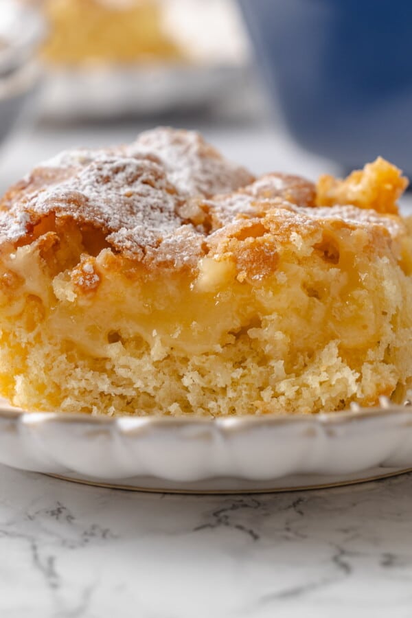 Center of gooey butter cake shown with buttery filling layered over the yeasted cake base.