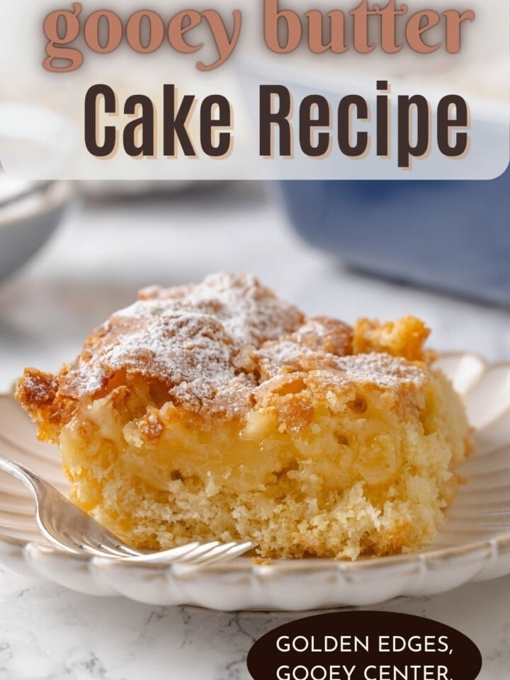Finished gooey butter cake with powdered sugar sprinkled generously across the golden brown surface.