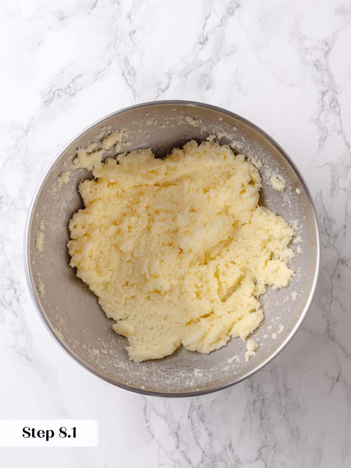 Softened butter and sugar are creamed together to start the base of the cake.