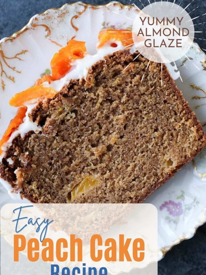 Slice of cake on a white decorative plate, showing soft crumb texture and white topping with dried peaches.