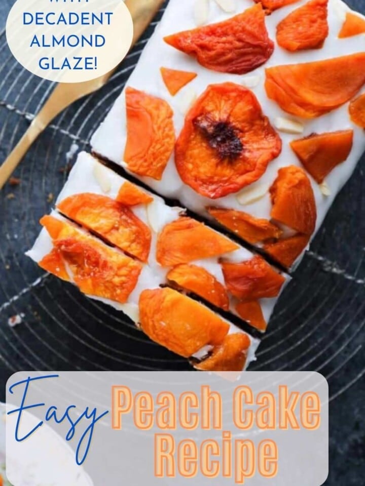 Sliced loaf cake from above, showing the white almond glazed topping and pretty slices of dried peach on top.