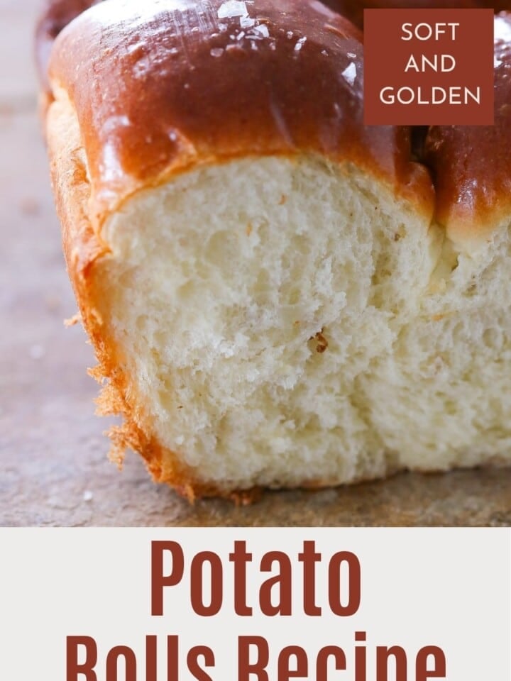 Fluffy and golden potato rolls on a wooden table, perfect for family meals.