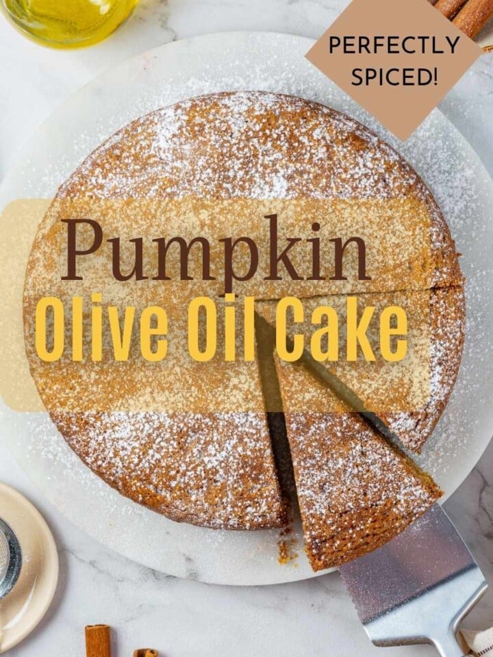 A homemade pumpkin cake with soft texture and rich color cooling on countertop.