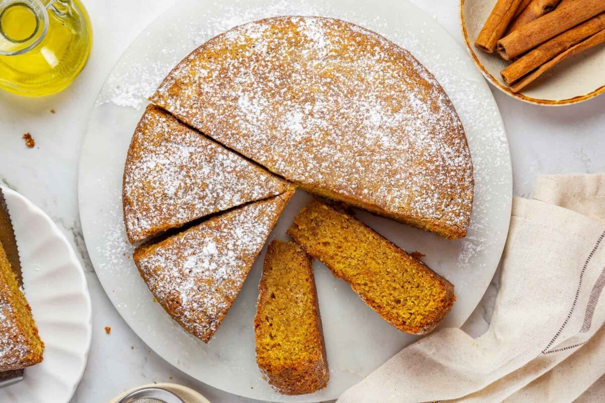 Moist pumpkin cake sliced to show tender inside and balanced blend of fall spices.