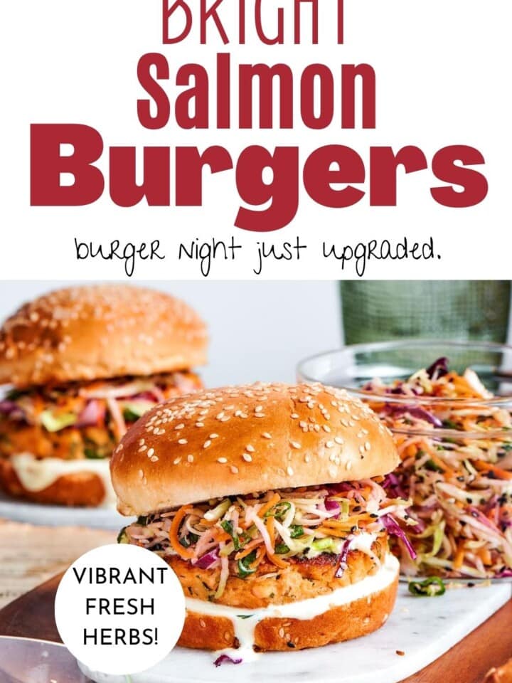 Juicy salmon patties stacked with crisp slaw and tangy yogurt sauce on a fresh bun.