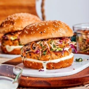 Lightly toasted burger bun ready to be topped with slaw and salmon.