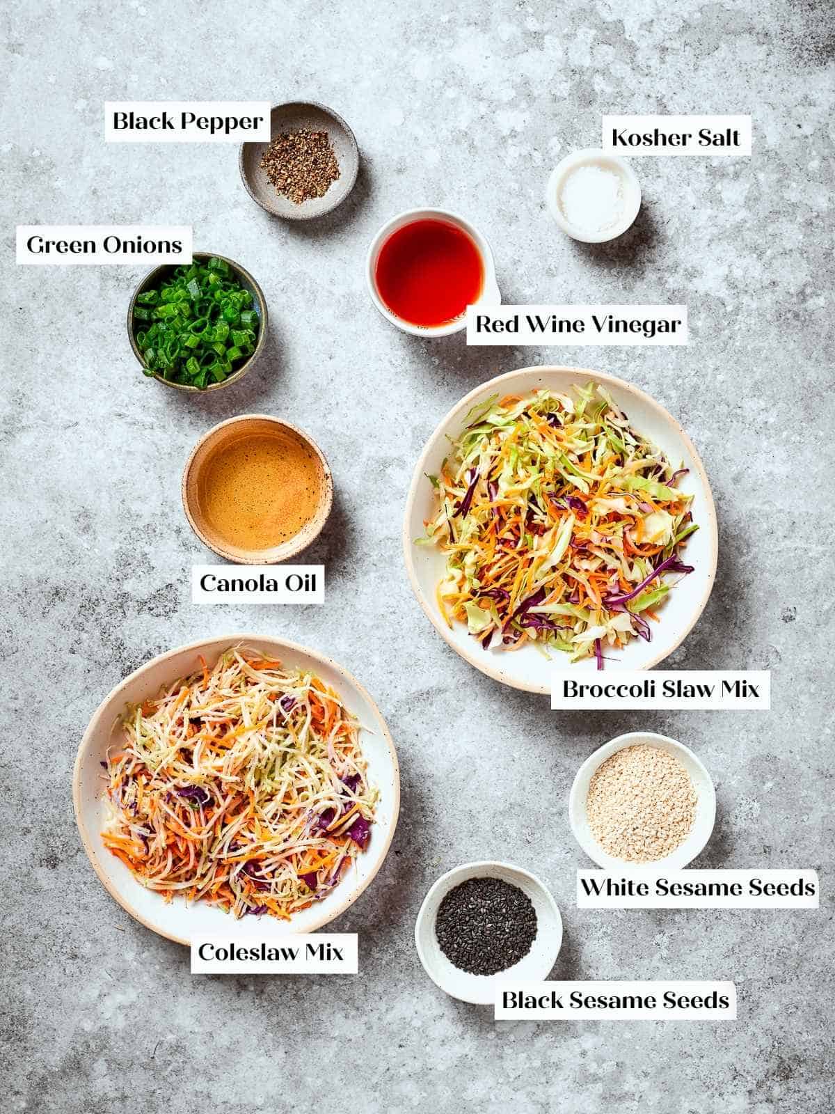 Unmixed ingredients for broccoli slaw shown together measured out on a countertop.