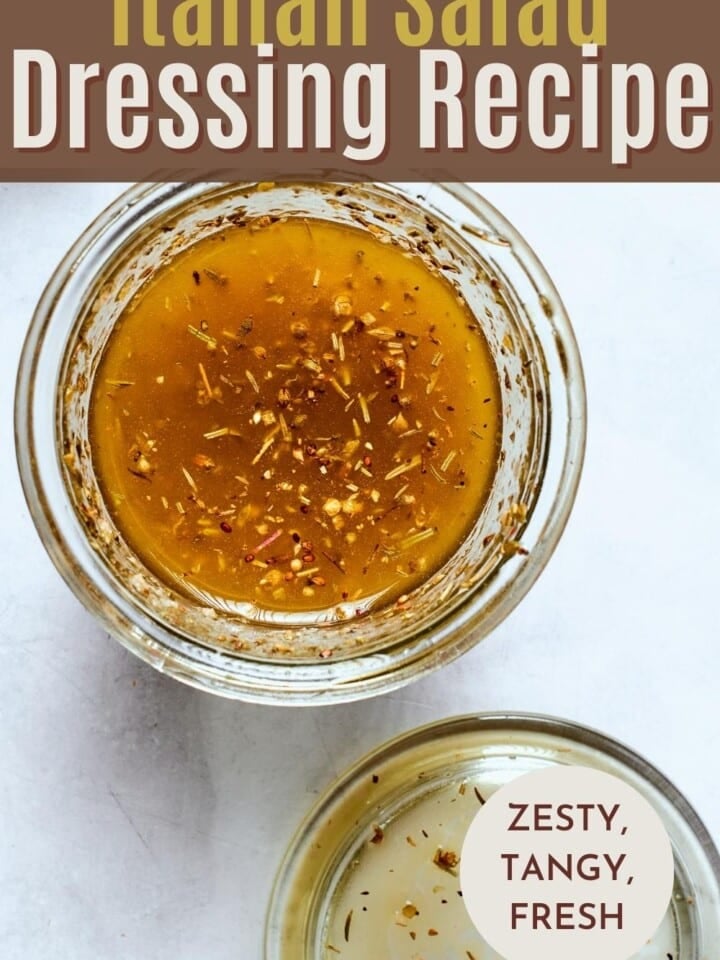 Tangy Italian salad dressing with red wine vinegar, olive oil, and parmesan in a clear jar.