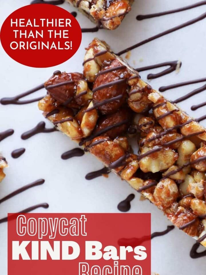 Nut bars drizzled with dark chooclate arranged on parchment with text that reads healthier than the originals KIND bars.