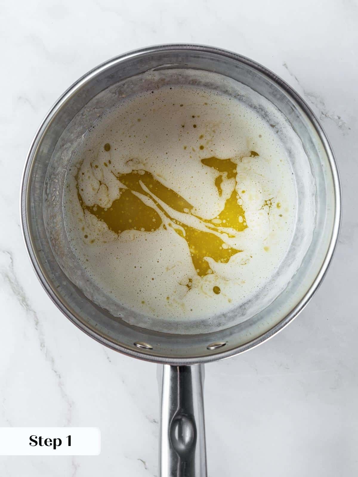 Melted butter in pan prepared for browning to make chewy pumpkin snickerdoodles.