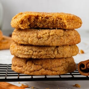 Stack of pumpkin snickerdoodle cookies highlighting chewy centers and sugar-dusted tops.