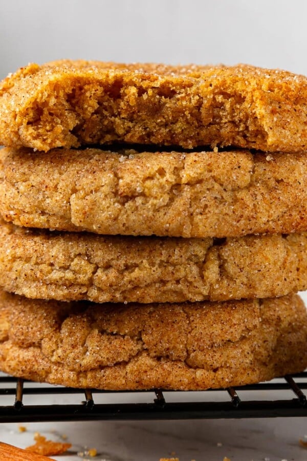 Stack of pumpkin snickerdoodle cookies highlighting chewy centers and sugar-dusted tops.