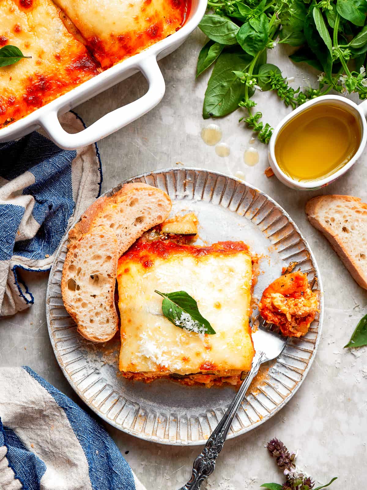 Baked zucchini lasagna square topped with bubbly, browned cheese straight from the oven.