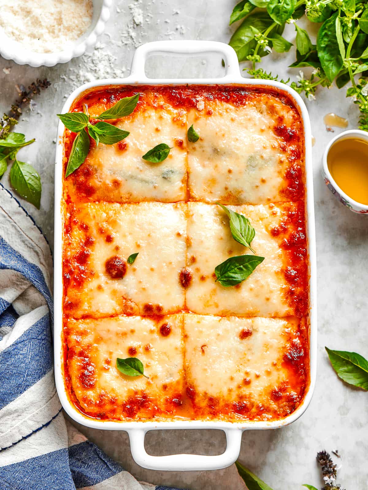 Full zucchini lasagna cut into squares, revealing clean, distinct layers and melted cheese.