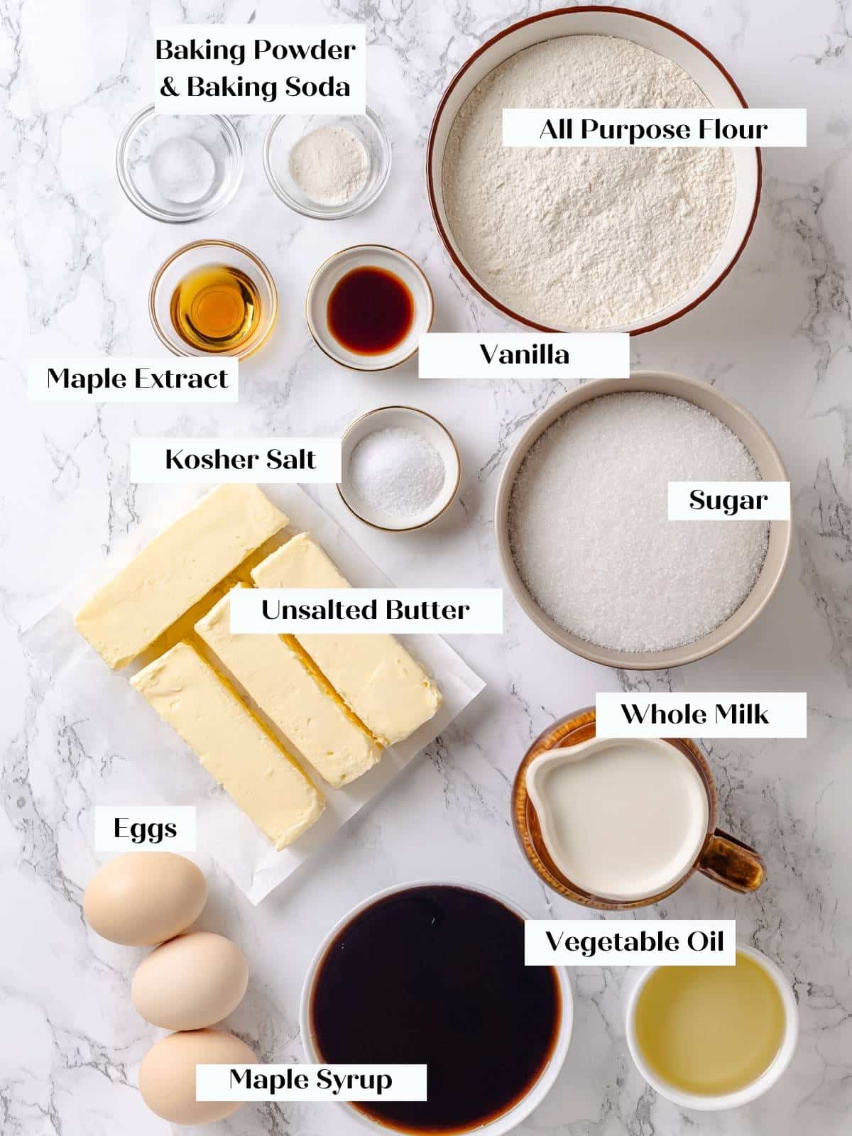 Baking ingredients for maple cake arranged on kitchen counter, ready to mix.