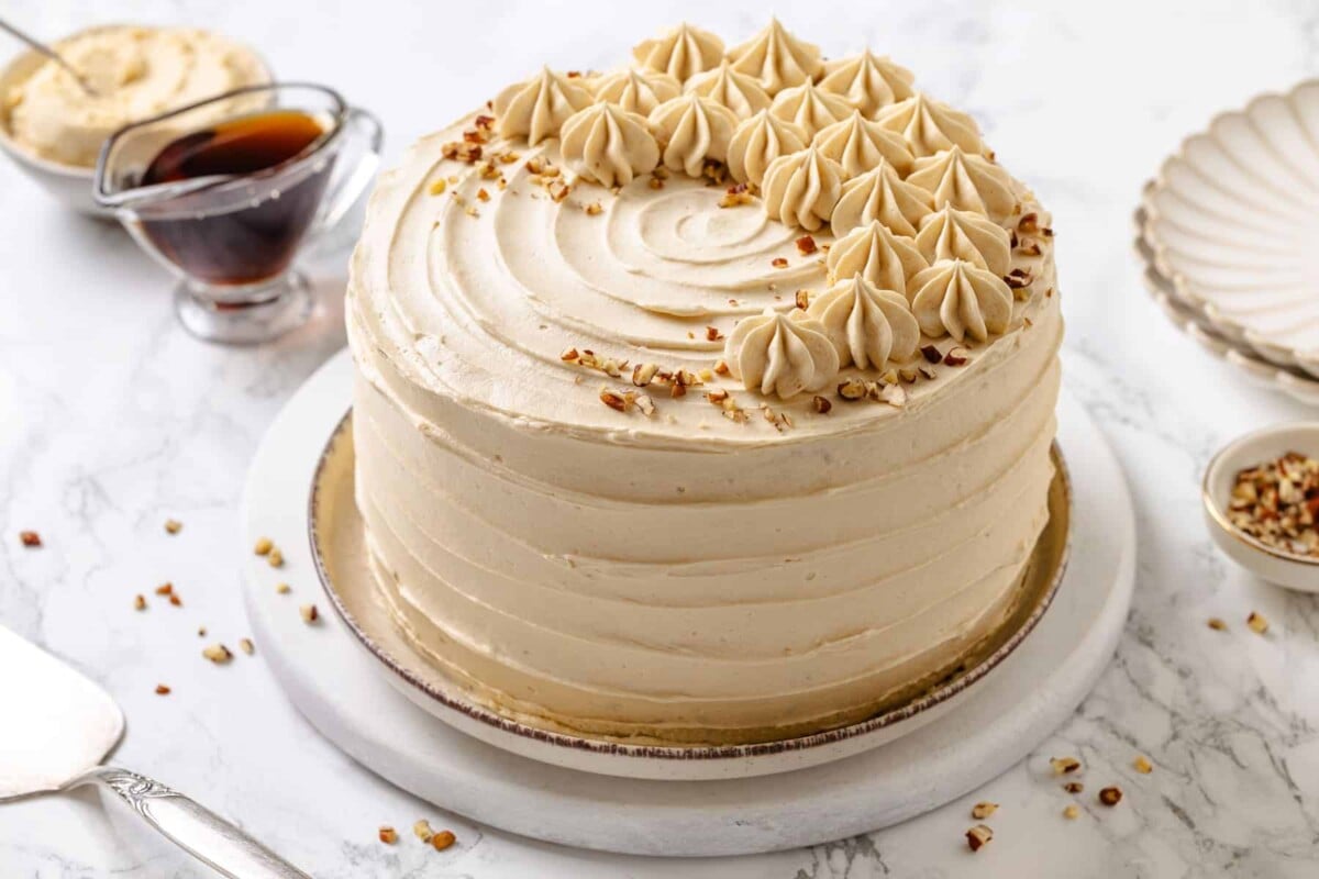 maple cake left unsliced and frosted.