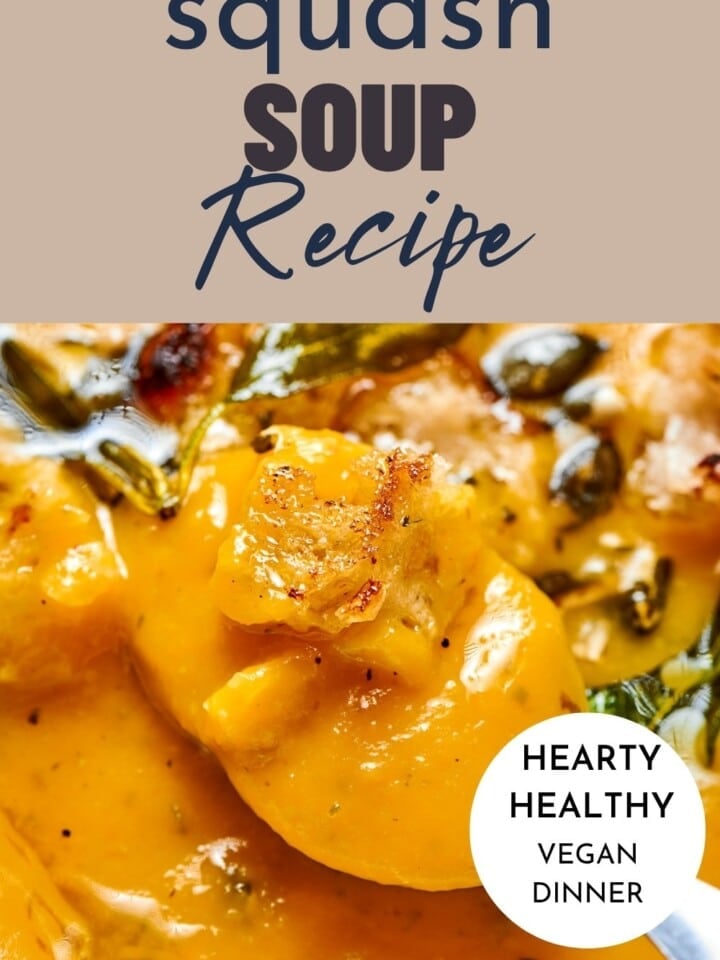 Healthy squash soup with smooth purée texture, topped with crunchy seeds and a drizzle of oil.
