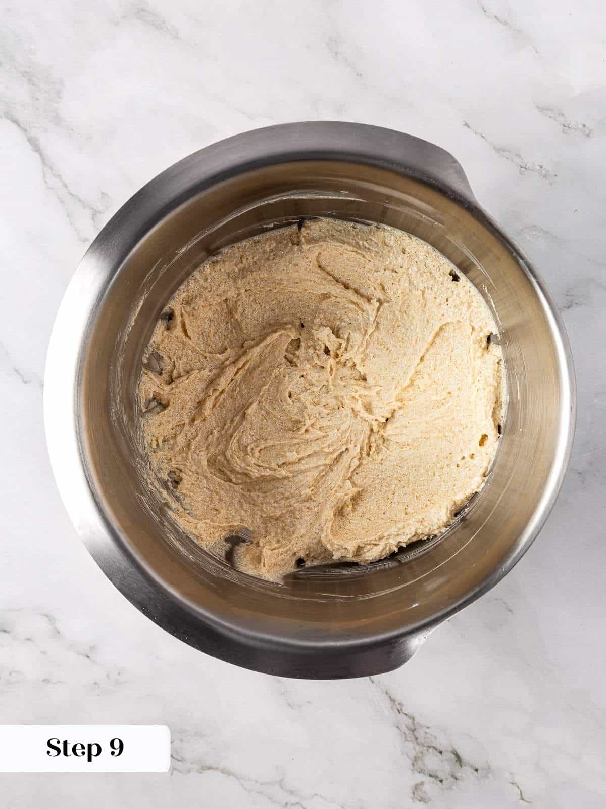 Butter and sugars being creamed together until light and fluffy for the cookie dough base.