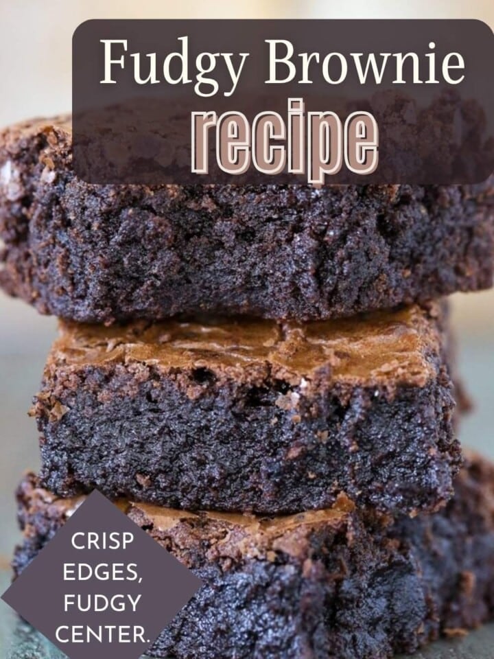 Stack of chewy chocolate brownies cut into squares.