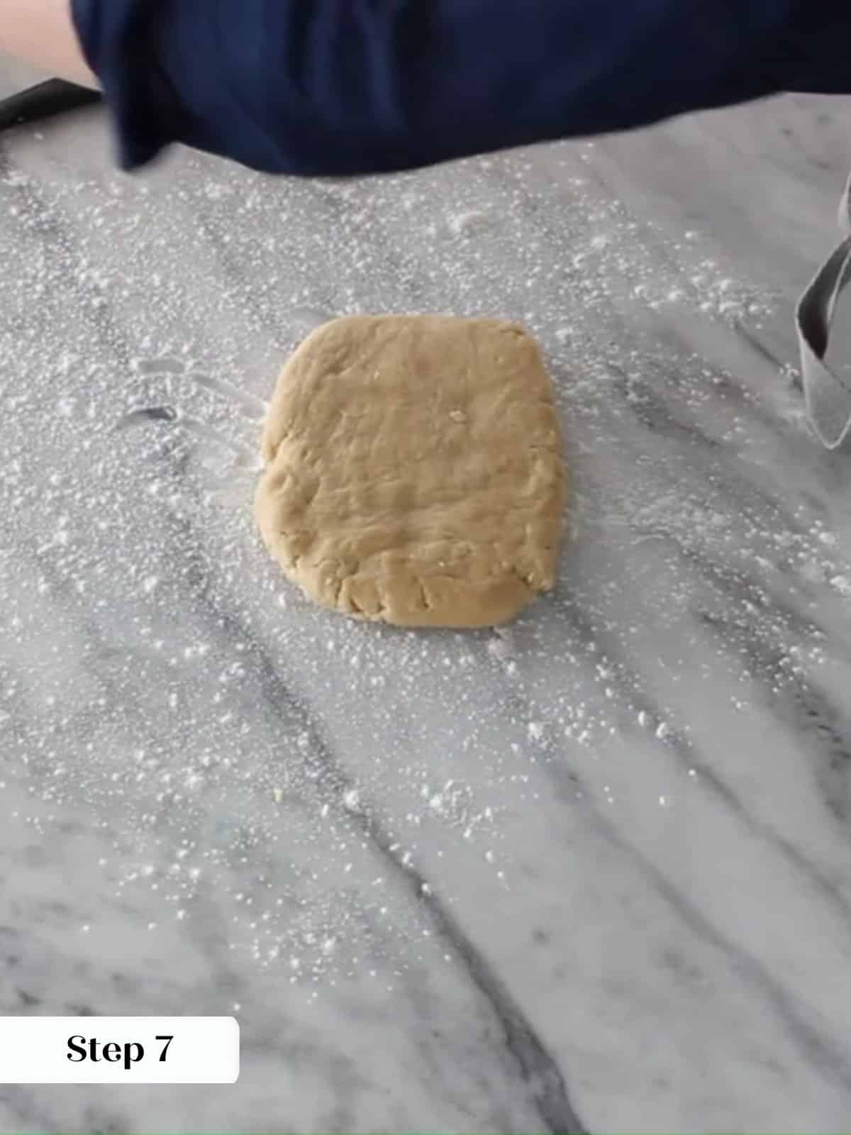 Chilled almond dough on countertop, ready for the next baking step.