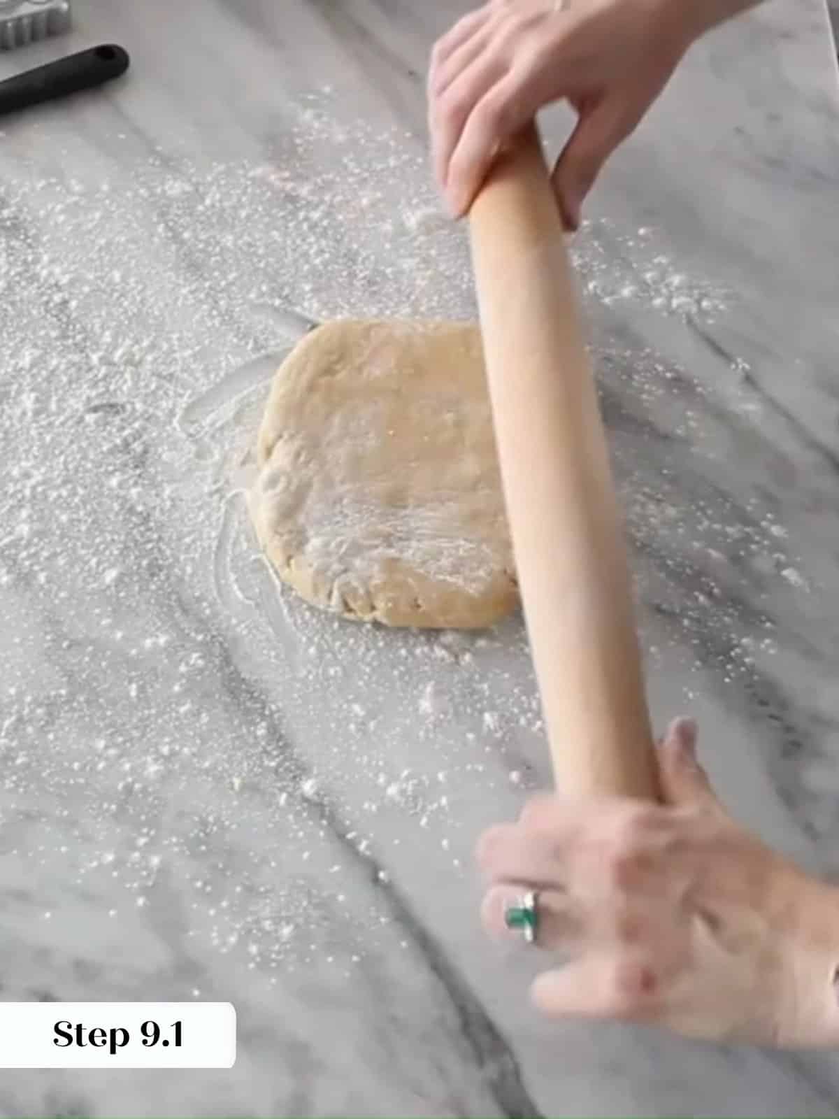 Chilled dough resting on a floured countertop, ready to roll out for cookie cutting.
