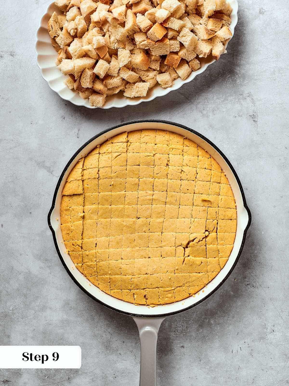Freshly baked cornbread cut into cubes and cooling in a pan before drying.