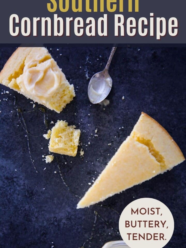 Wedge of cornbread served on a countertop with butter.