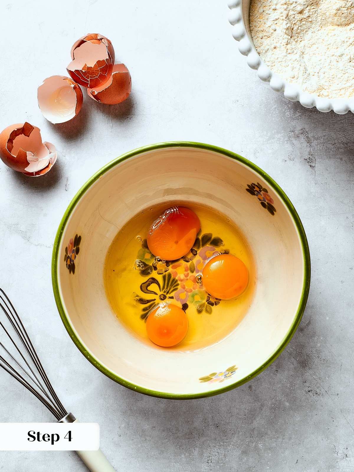 Eggs being whisked in a mixing bowl to start the base for moist Southern cornbread batter.